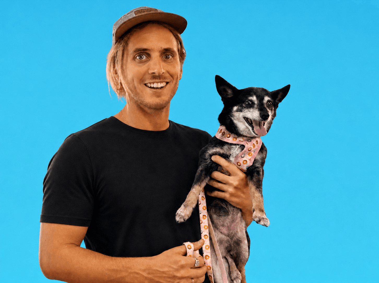 Steve, founder of Wahlu Labs, holding his dog.