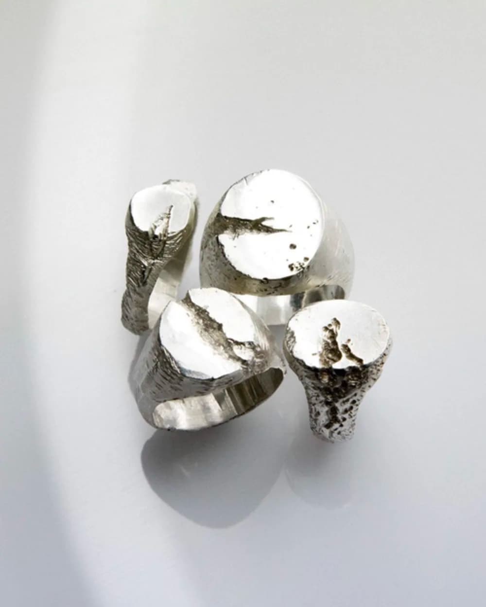 A group of handmade silver rings